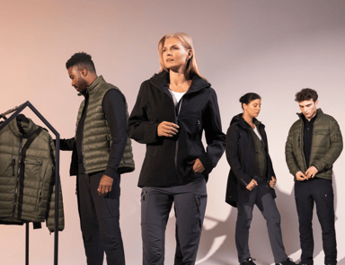 A group of models presenting South West’s collection of functional jackets and vests – garments for both work and leisure.