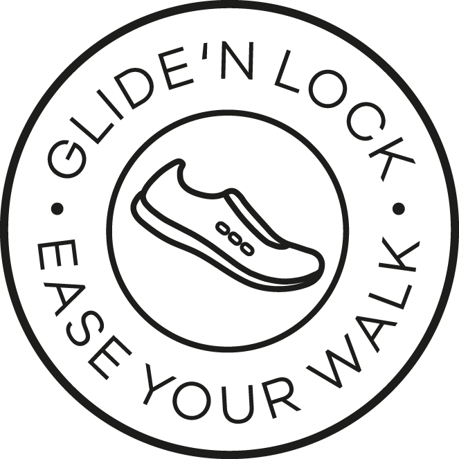 Rund symbol med en sko i rörelse och texten “Glide’n Lock – Ease Your Walk”. Visar att skon har en teknik som hjälper foten att glida i isättning och låsa i frånskjut för en smidigare gång.